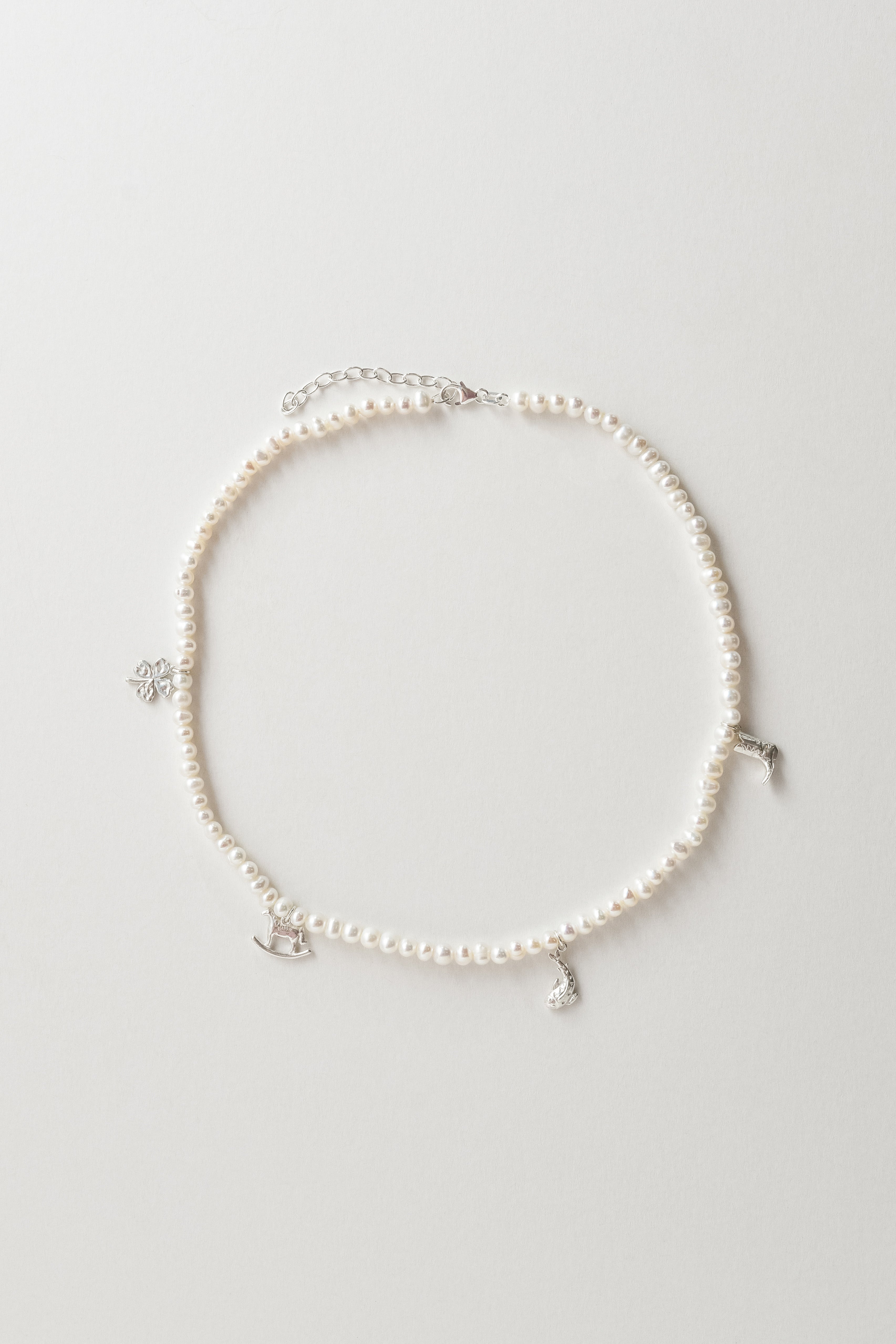 Pearls with AIDA Amulets