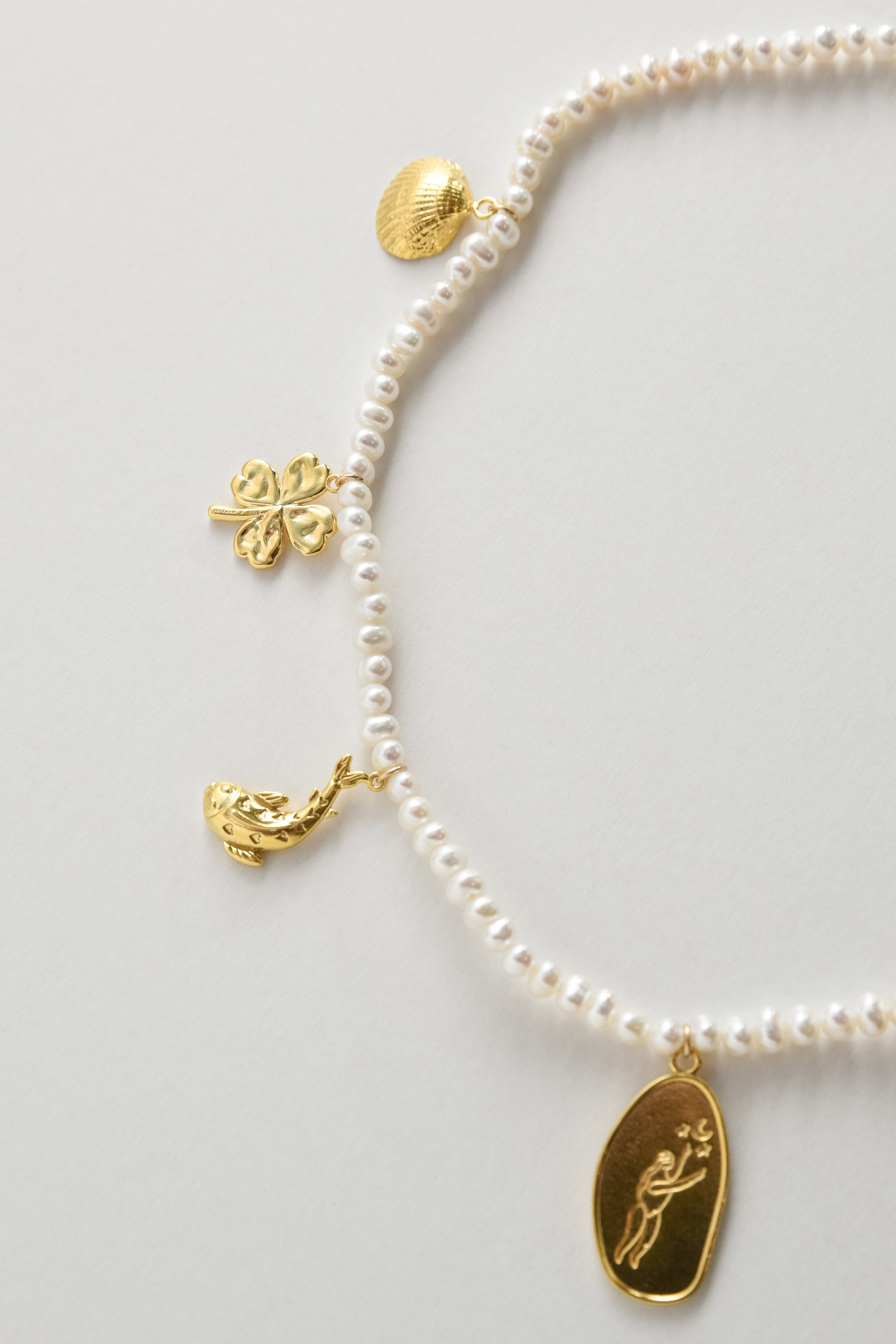 Pearls with AIDA Amulets