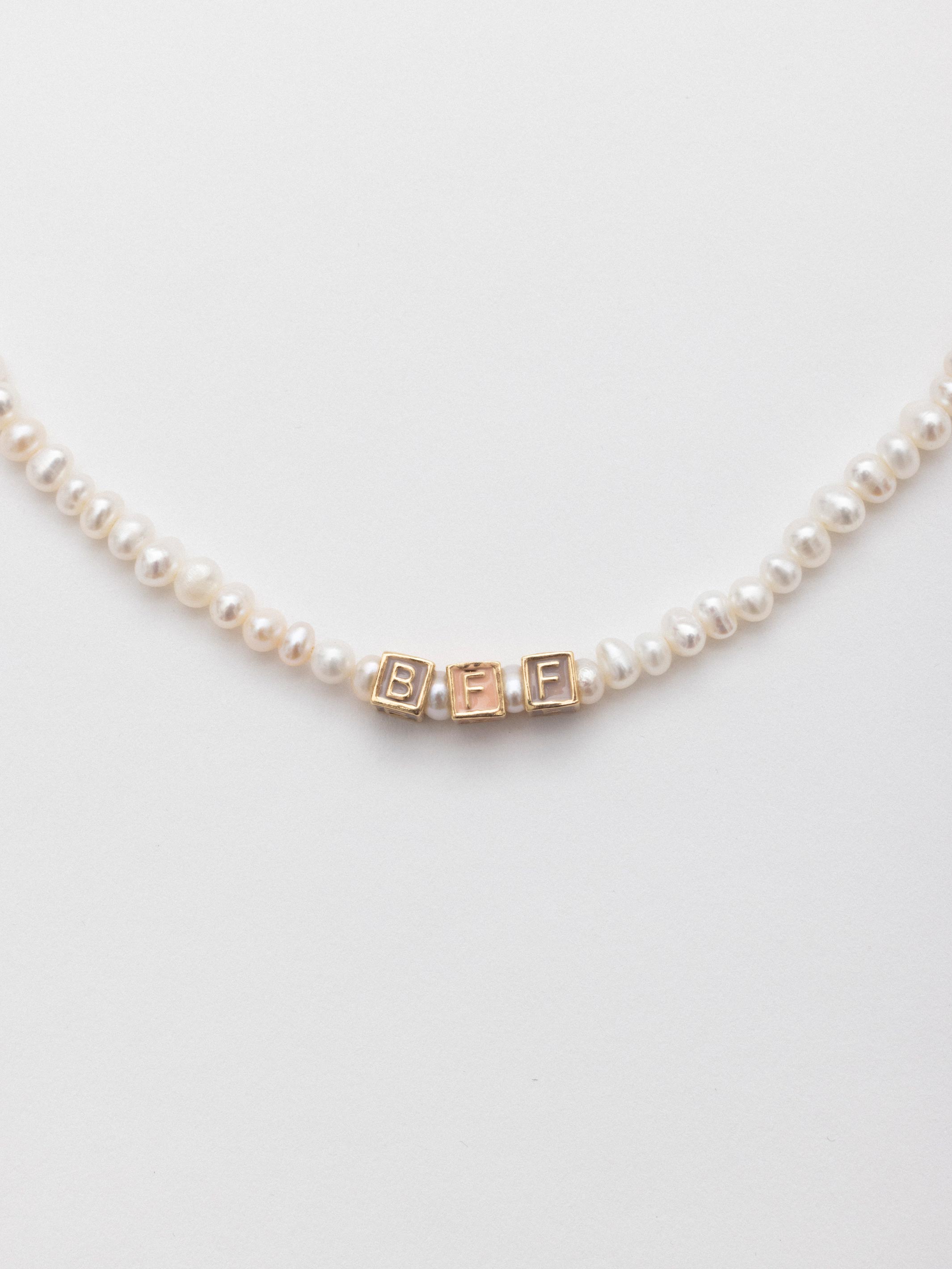 aida impact letter pearl necklace gold